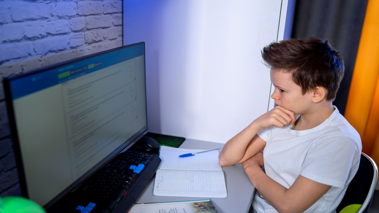 A junior developer at a desk surrounded by documentation and tutorial tabs